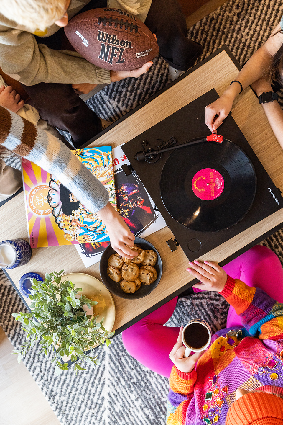 Aerial view of a table with food and a record