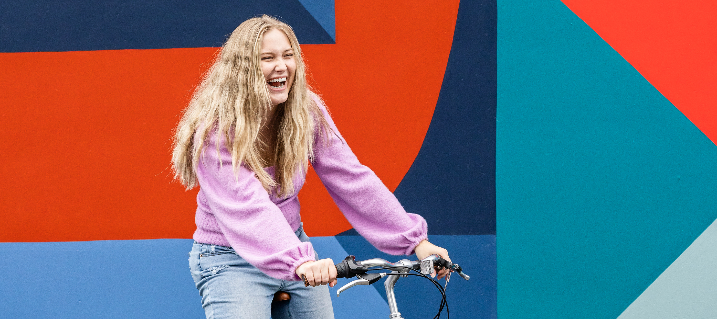 A woman sitting on a bicycle