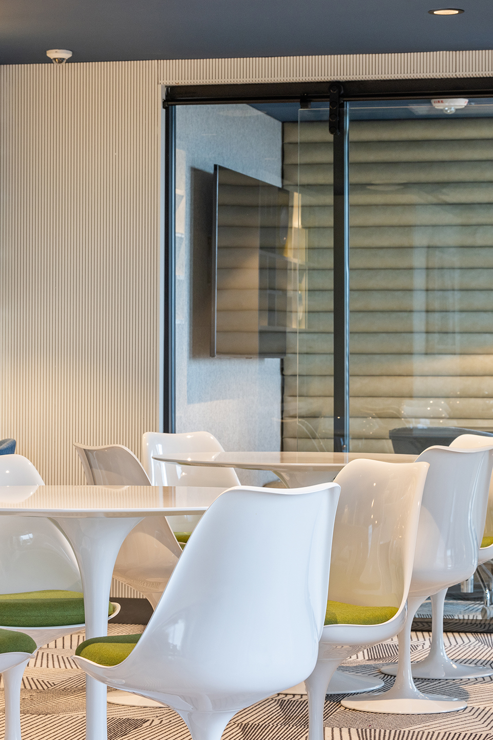 A study room with white chairs