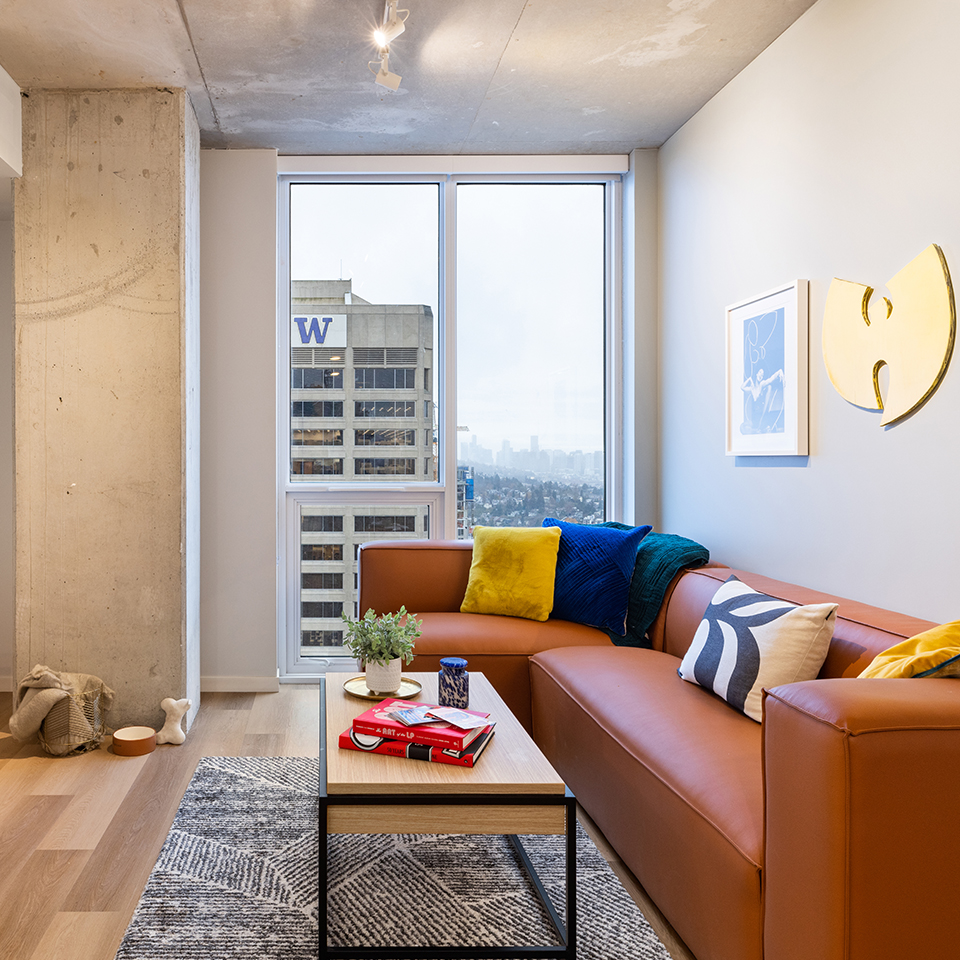 A living room with an orange couch
